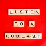 Wooden Scrabble tiles on red background spelling 'Listen to a Podcast'.